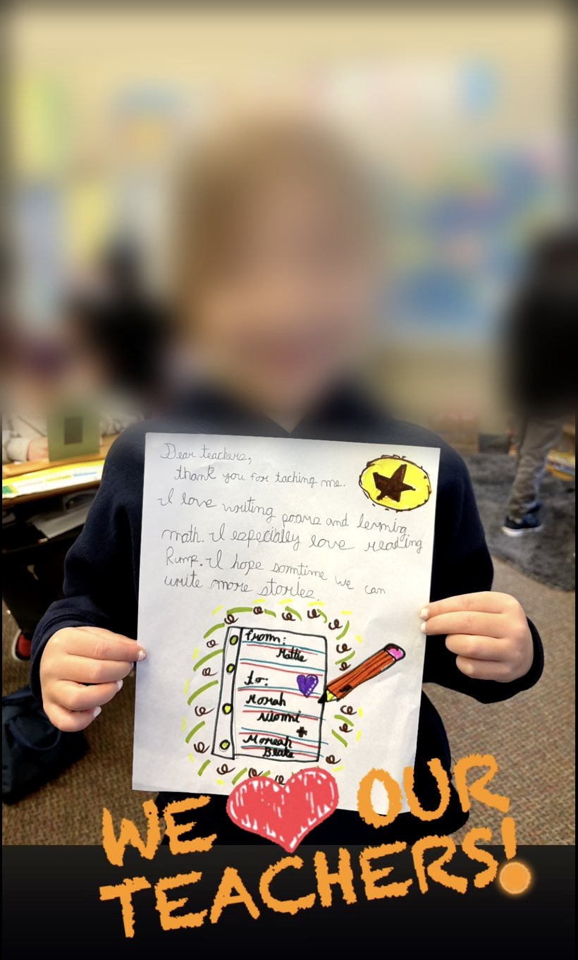 A young student holding a handmade thank-you note to her teachers, with the words 'We love our teachers!'